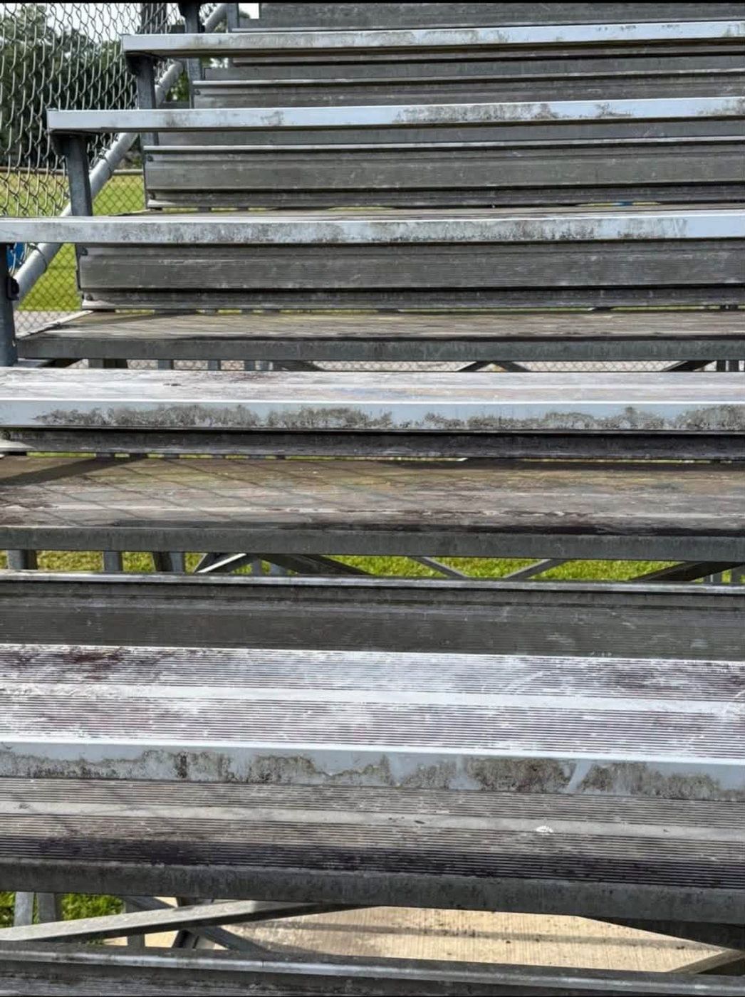 Stadium bleachers before soft washing