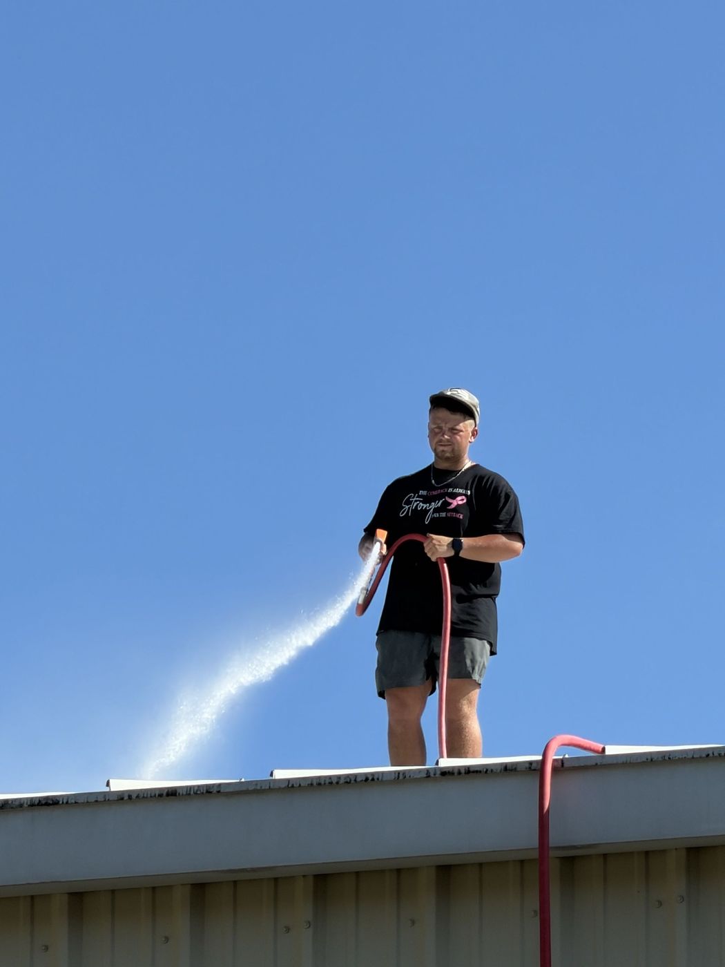 Soft washing a metal roof