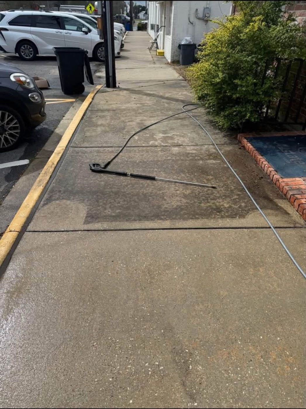 Pressure washing a downtown sidewalk